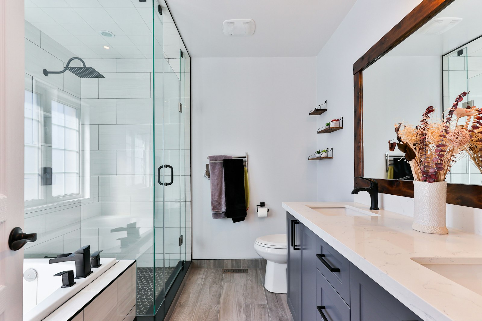 Renovated bathroom with glass shower and new vanity