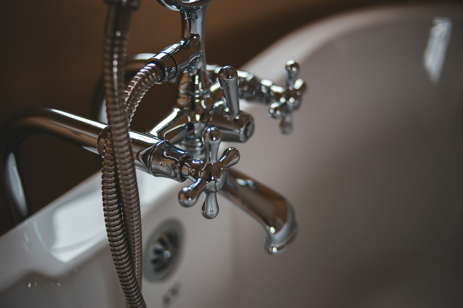 Chrome plumbing fixtures on a bathtub